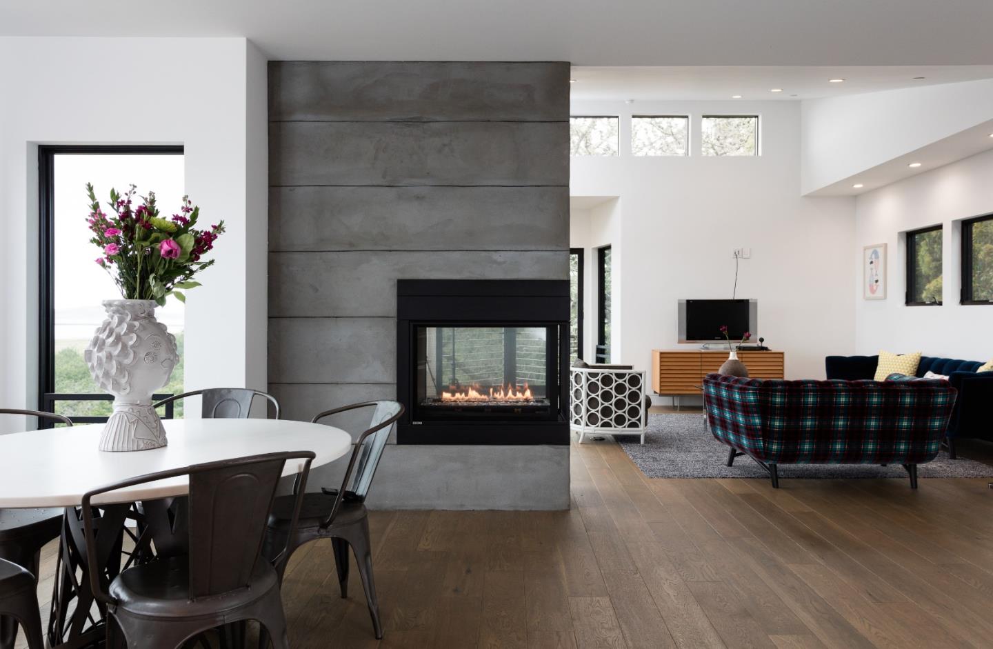 311 Magellan Avenue Half Moon Bay, CA 94019 - Photo 10 of 37 a living room with furniture a flat screen tv and a fireplace