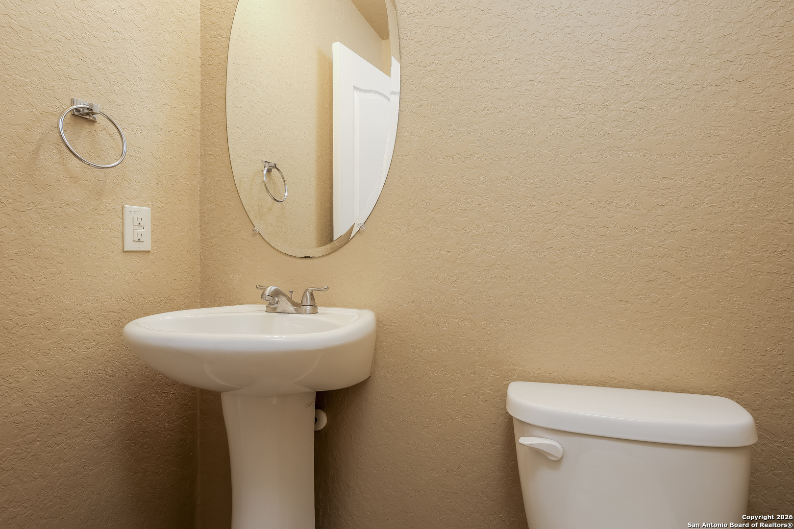 3415 Dunlap Fields Converse, TX 78109 - Photo 12 of 17 a bathroom with a sink a toilet and mirror