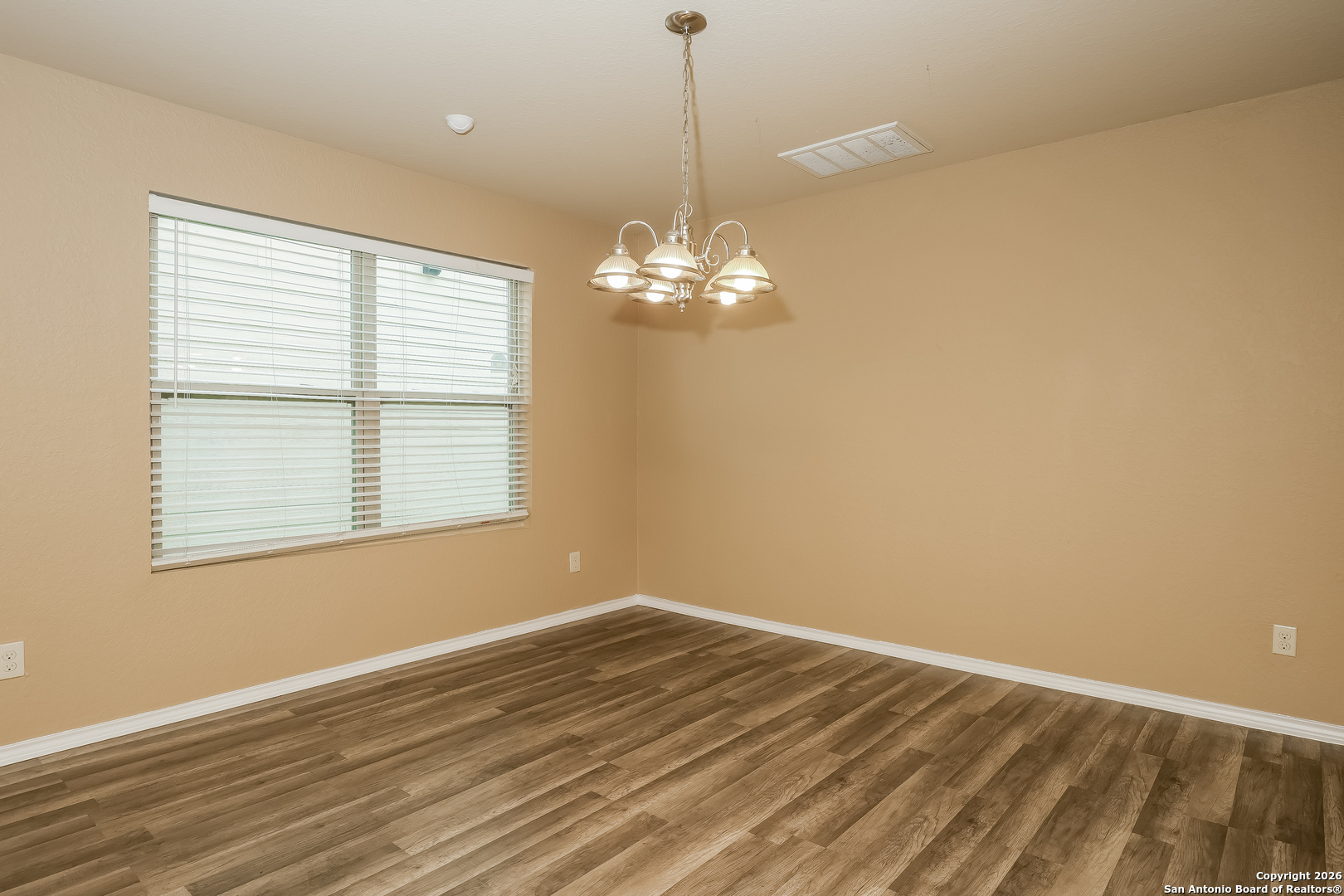 3415 Dunlap Fields Converse, TX 78109 - Photo 5 of 17 a view of wooden floor and a chandelier in a room