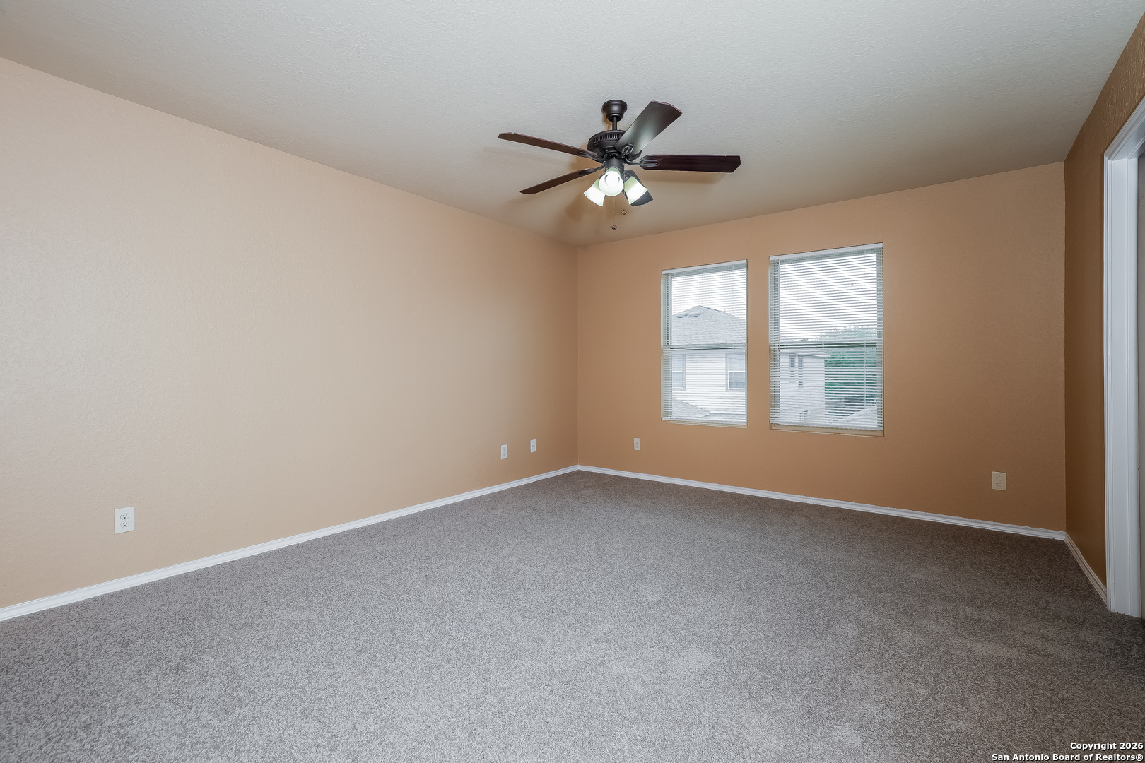 3415 Dunlap Fields Converse, TX 78109 - Photo 8 of 17 an empty room with windows and fan