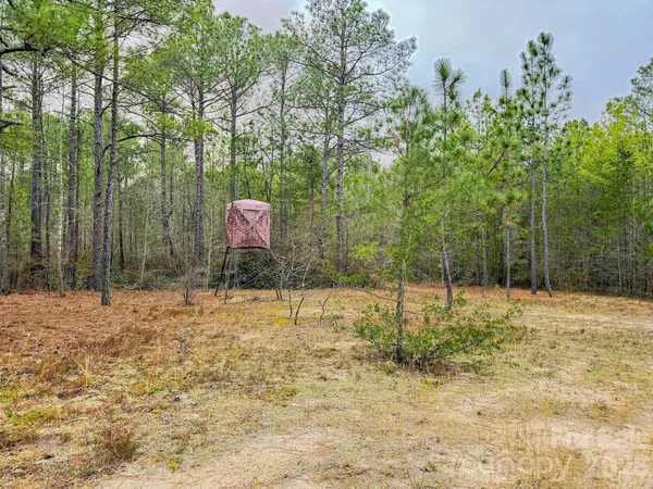 an aerial view of ocean with residential house with outdoor space