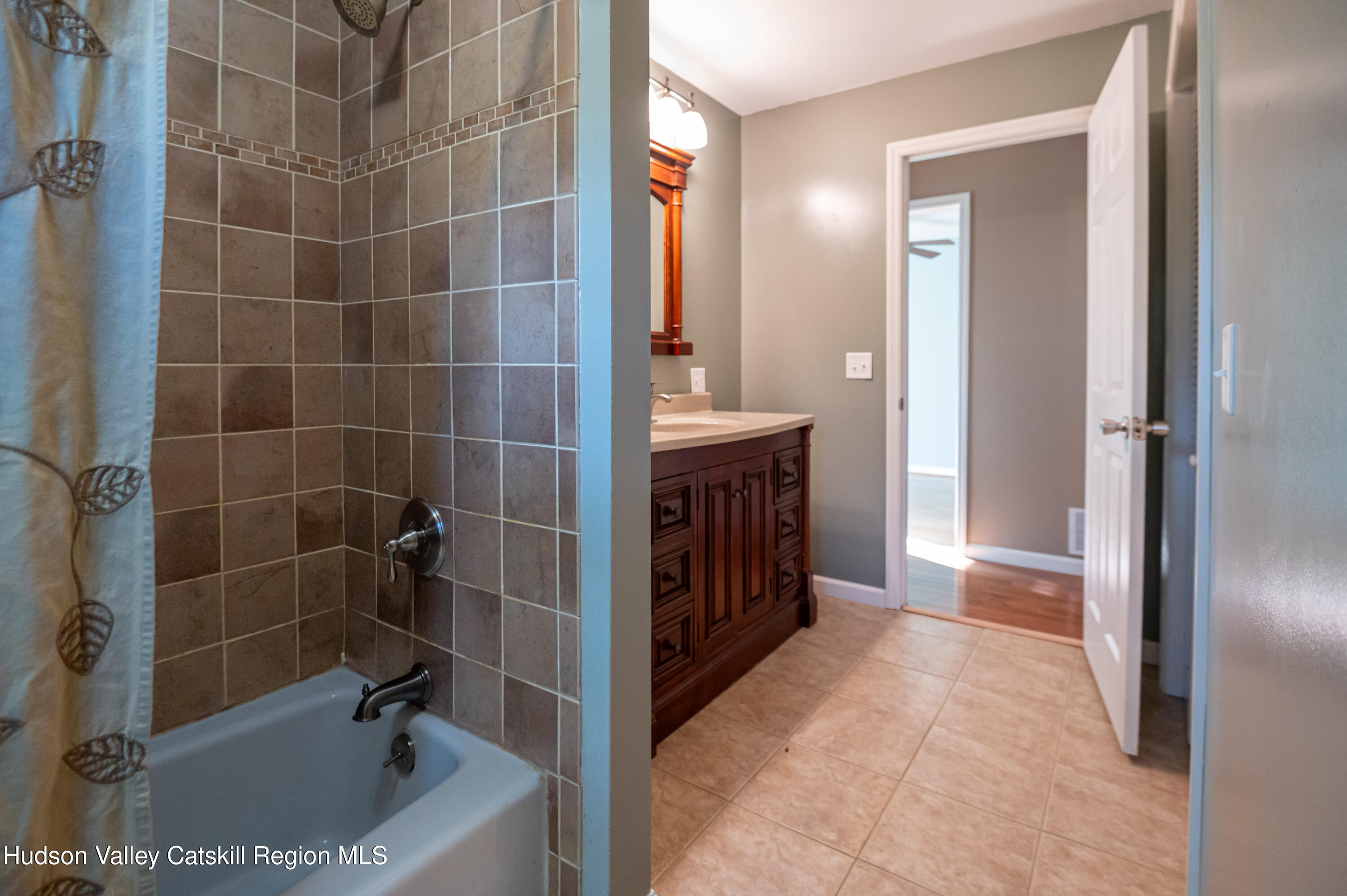 59 Hawley Road Niverville, NY 12130 - Photo 12 of 20 a bathroom with a bathtub and a shower