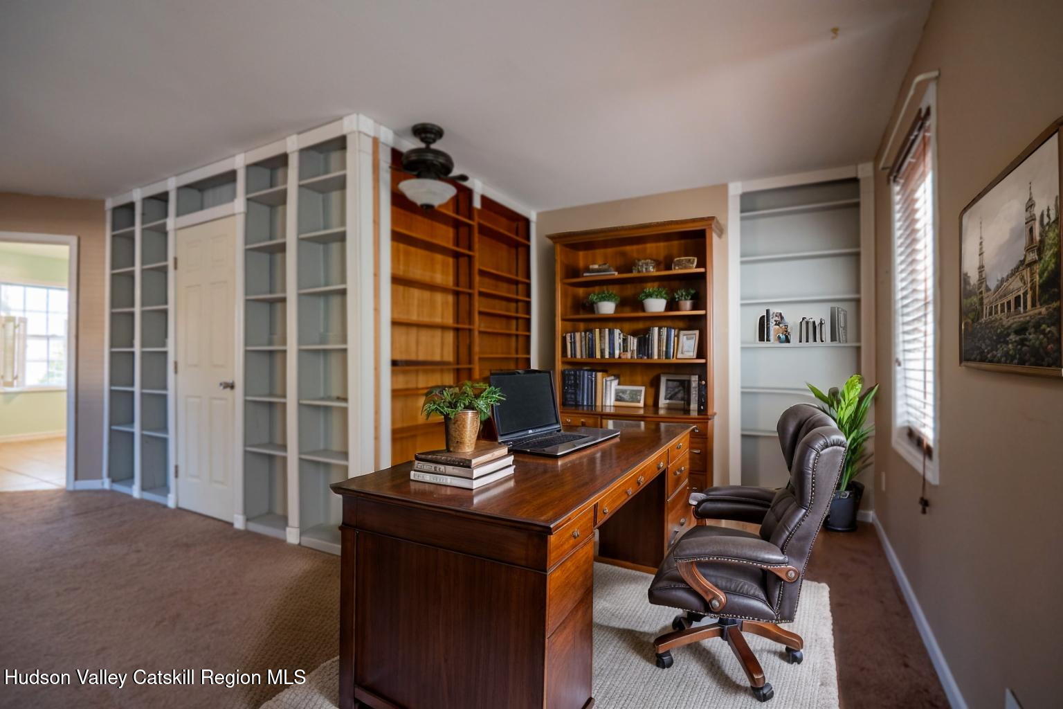 59 Hawley Road Niverville, NY 12130 - Photo 15 of 20 a view of a workspace with furniture and a window