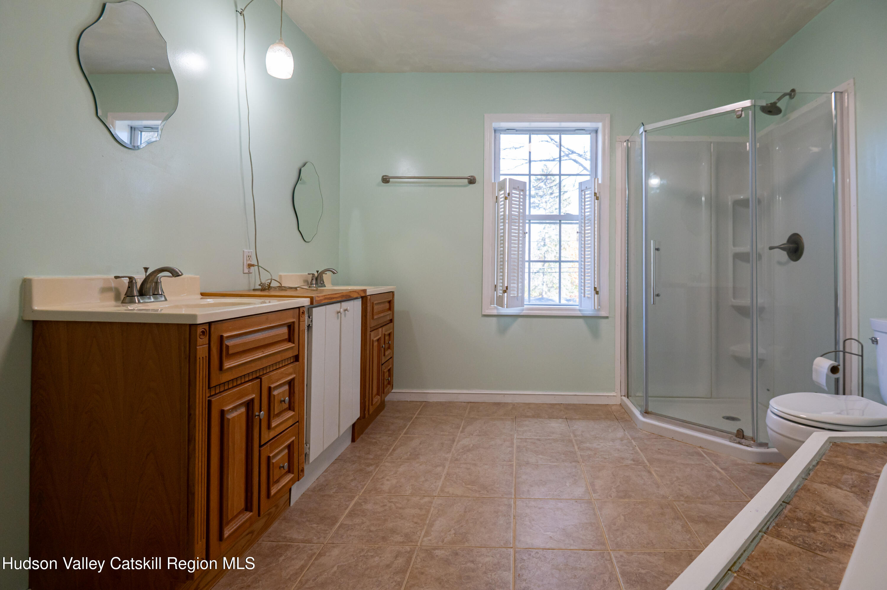 59 Hawley Road Niverville, NY 12130 - Photo 17 of 20 a bathroom with a double vanity sink mirror and shower