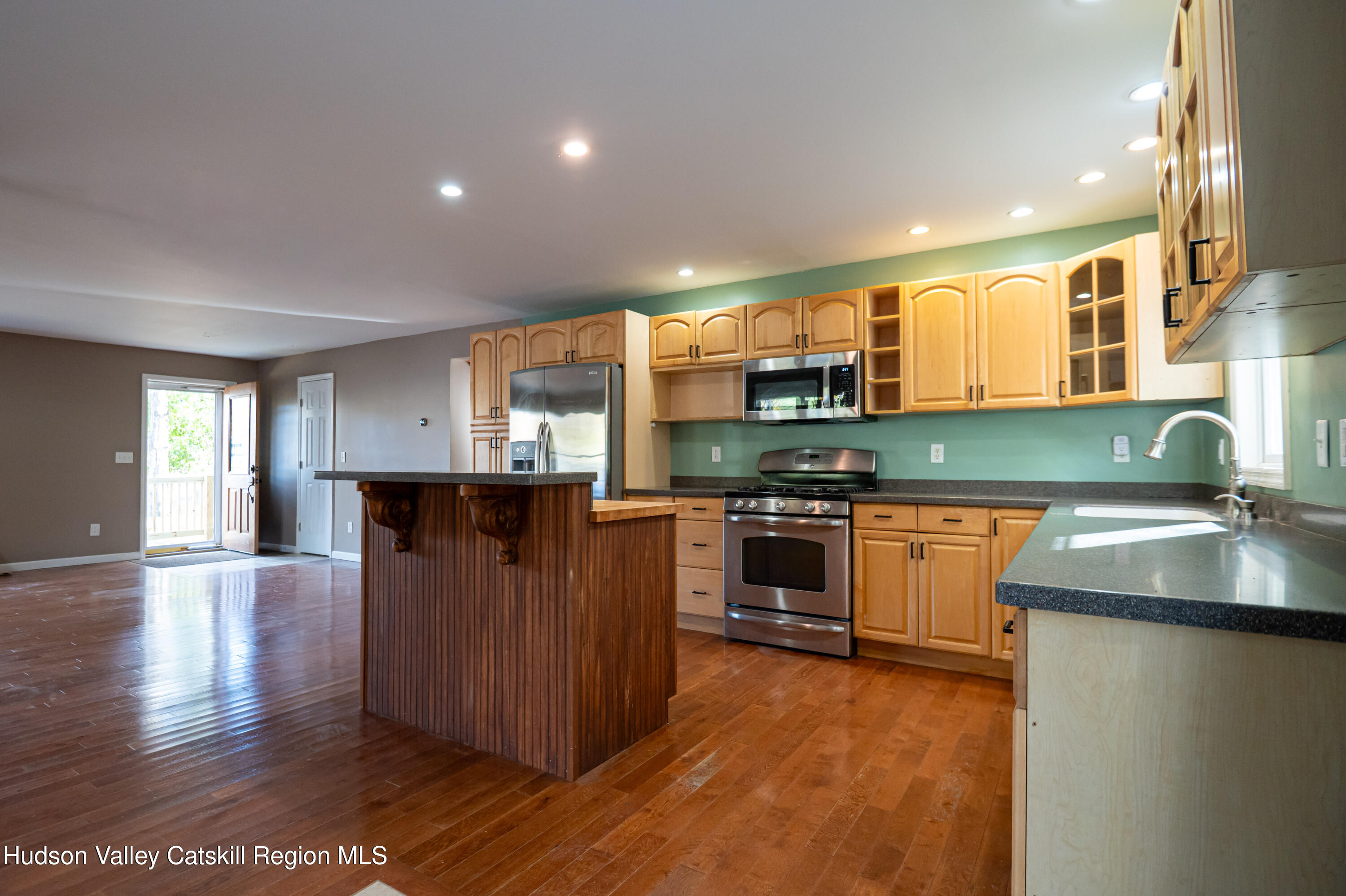 59 Hawley Road Niverville, NY 12130 - Photo 6 of 20 a kitchen with stainless steel appliances granite countertop a sink and a stove
