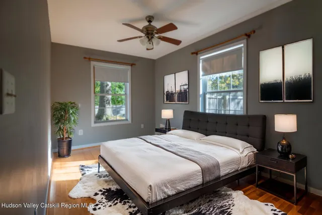 a bedroom with a bed and a lamp