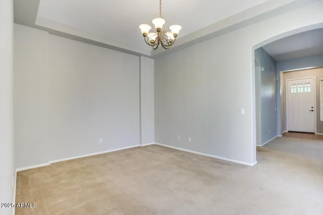 a view of a chandelier fan and closet in a room