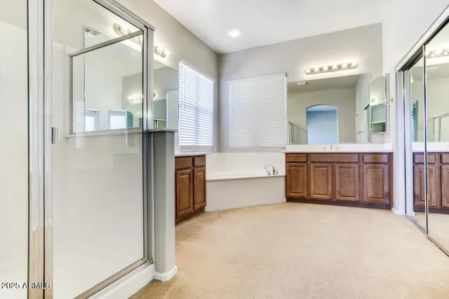 a view of a bathroom with sink and mirror