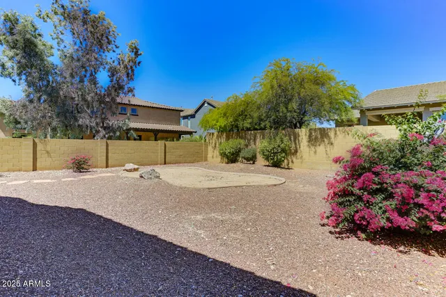 a front view of a house with a yard and a garage