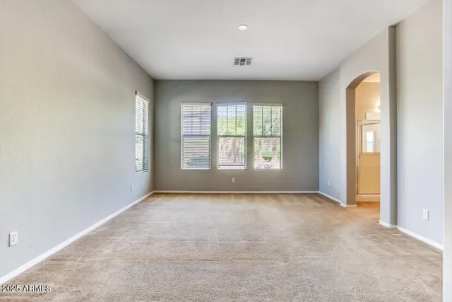 an empty room with windows