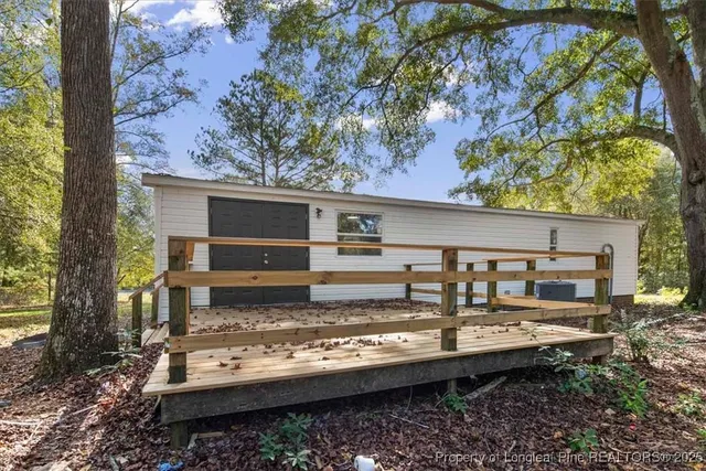 a view of a house with a yard and garage