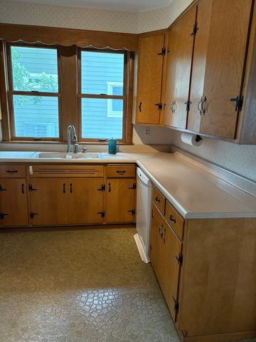 a bedroom with a bed and a lamp