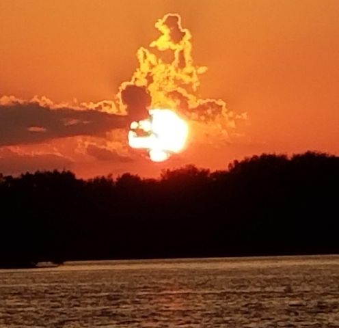 a view of ocean and sunset