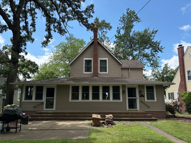 a front view of a house with yard