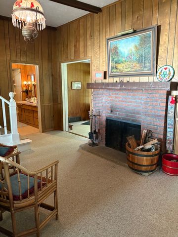 a room with furniture and a fireplace