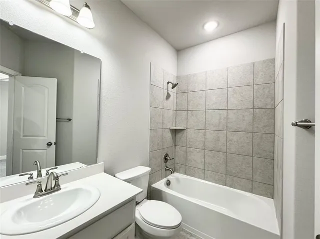 a bathroom with a sink toilet and bathtub