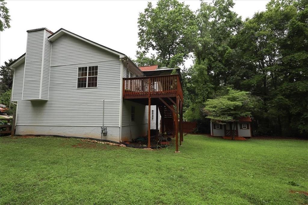 236 Hiram Sudie Road Dallas, GA 30157 - Photo 23 of 26 a house view with a garden space
