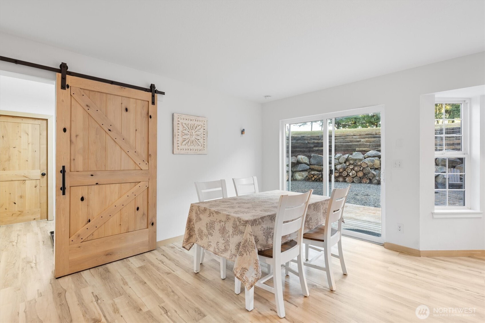508 Caldwell Road Castle Rock, WA 98611 - Photo 12 of 40 a view of a dining room with furniture window and wooden floor