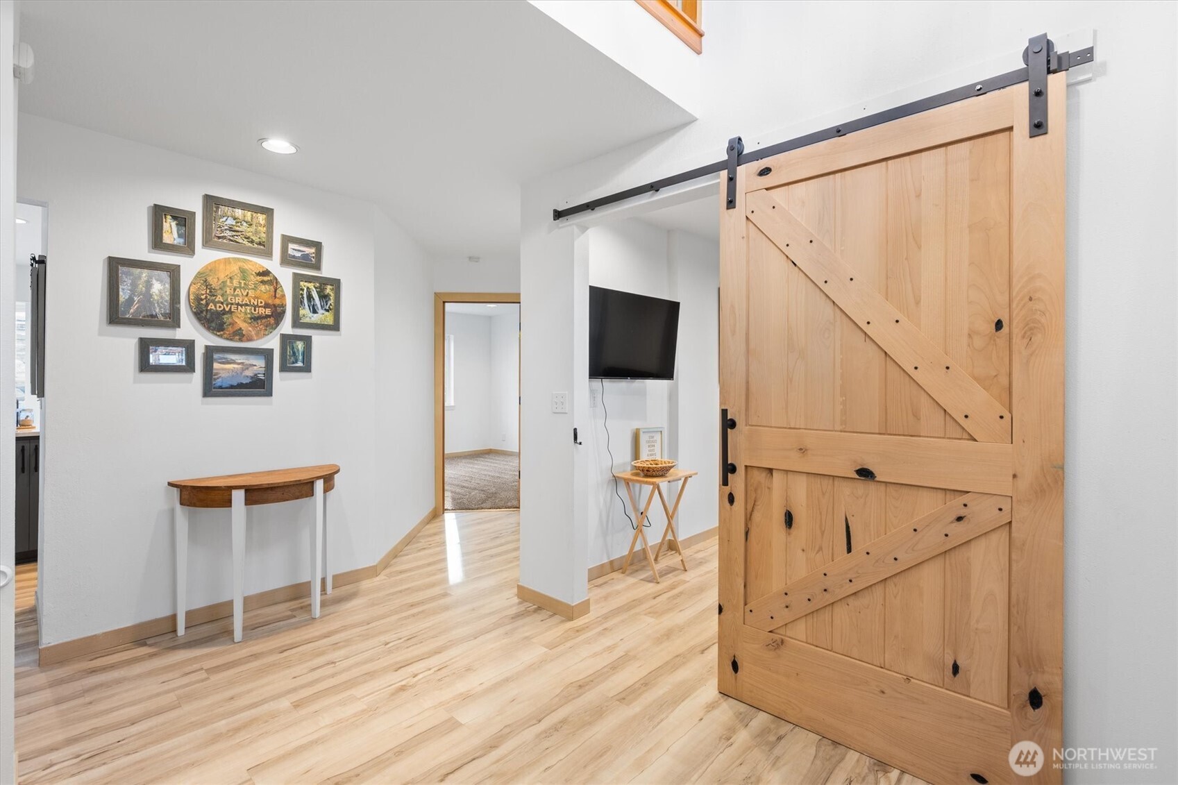 508 Caldwell Road Castle Rock, WA 98611 - Photo 4 of 40 a view of a hallway with wooden floor and staircase