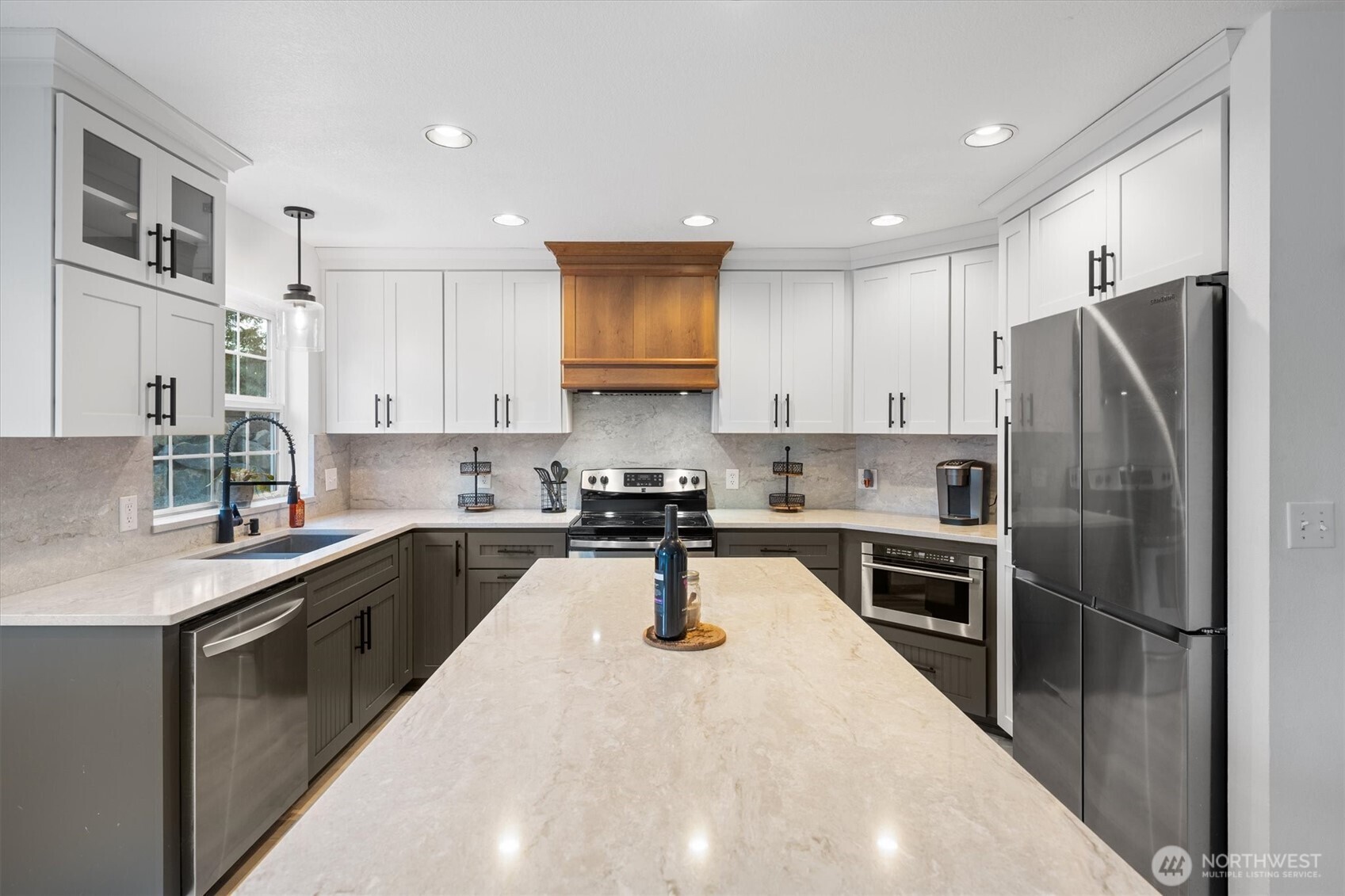 508 Caldwell Road Castle Rock, WA 98611 - Photo 8 of 40 a kitchen with stainless steel appliances granite countertop a sink refrigerator and cabinets