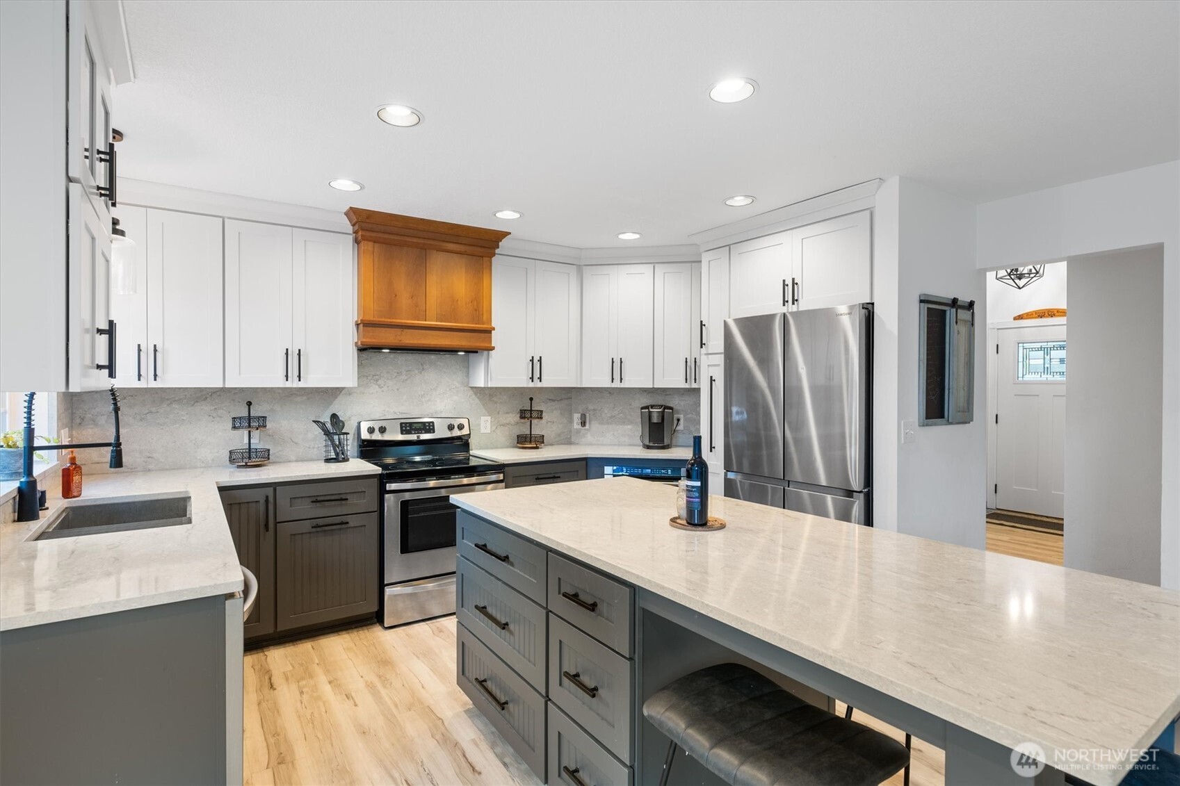 508 Caldwell Road Castle Rock, WA 98611 - Photo 10 of 40 a kitchen with kitchen island a counter top space a sink stainless steel appliances and cabinets