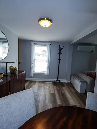 a living room with couch and a window