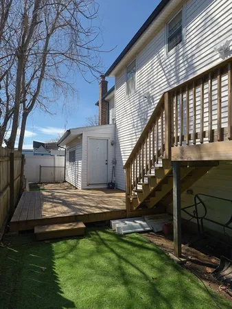 a view of house with backyard