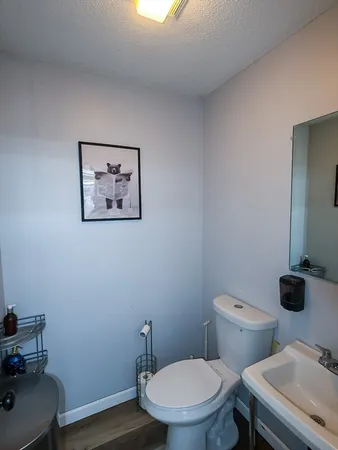 a bathroom with a toilet and a sink