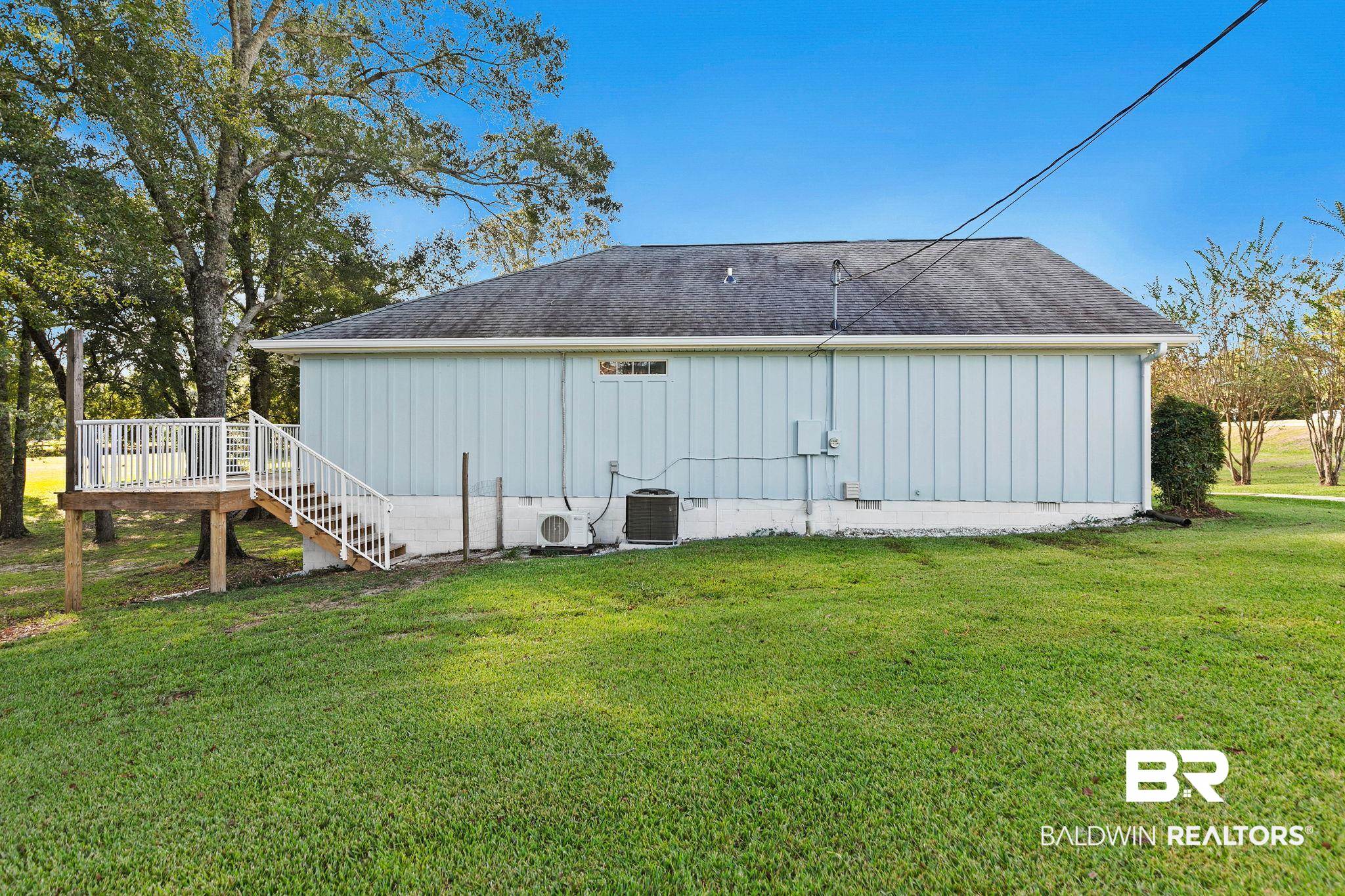 35650 Spring Road North Stapleton, AL 36578 - Photo 61 of 70 Rear view of property with roof with shingles, hardie siding, and a yard