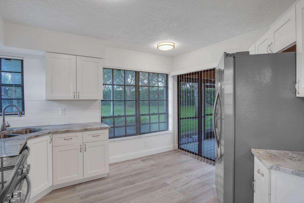 17388 Boca Club Boulevard, Unit 201 Boca Raton, FL 33487 - Photo 11 of 44 Kitchen to Patio.jpg-SMALL
