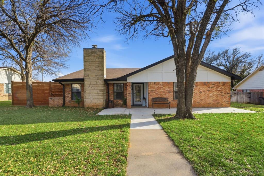 1008 Royal Lane Graham, TX 76450 - Photo 1 of 22 a front view of a house with garden
