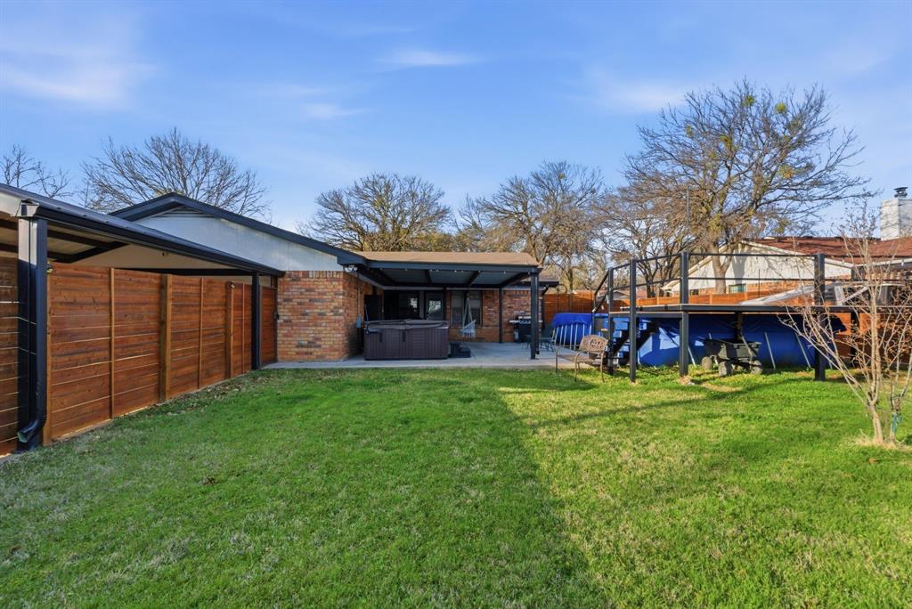 1008 Royal Lane Graham, TX 76450 - Photo 16 of 22 a view of a house with a yard and sitting area