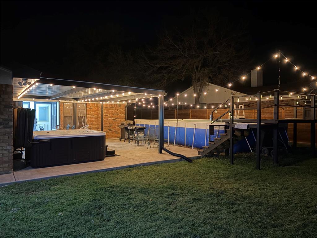 1008 Royal Lane Graham, TX 76450 - Photo 20 of 22 a view of a backyard with sitting area