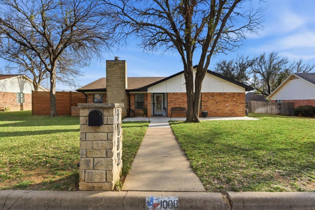 1008 Royal Lane Graham, TX 76450 - Photo 2 of 22 a front view of a house with garden