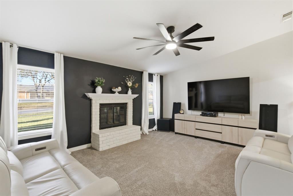 1008 Royal Lane Graham, TX 76450 - Photo 3 of 22 a living room with furniture and a flat screen tv