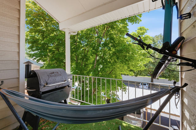 650 South Main Street, Unit 3304 Bountiful, UT 84010 - Photo 18 of 22 Covered outdoor balcony featuring a white metal railing and tan siding