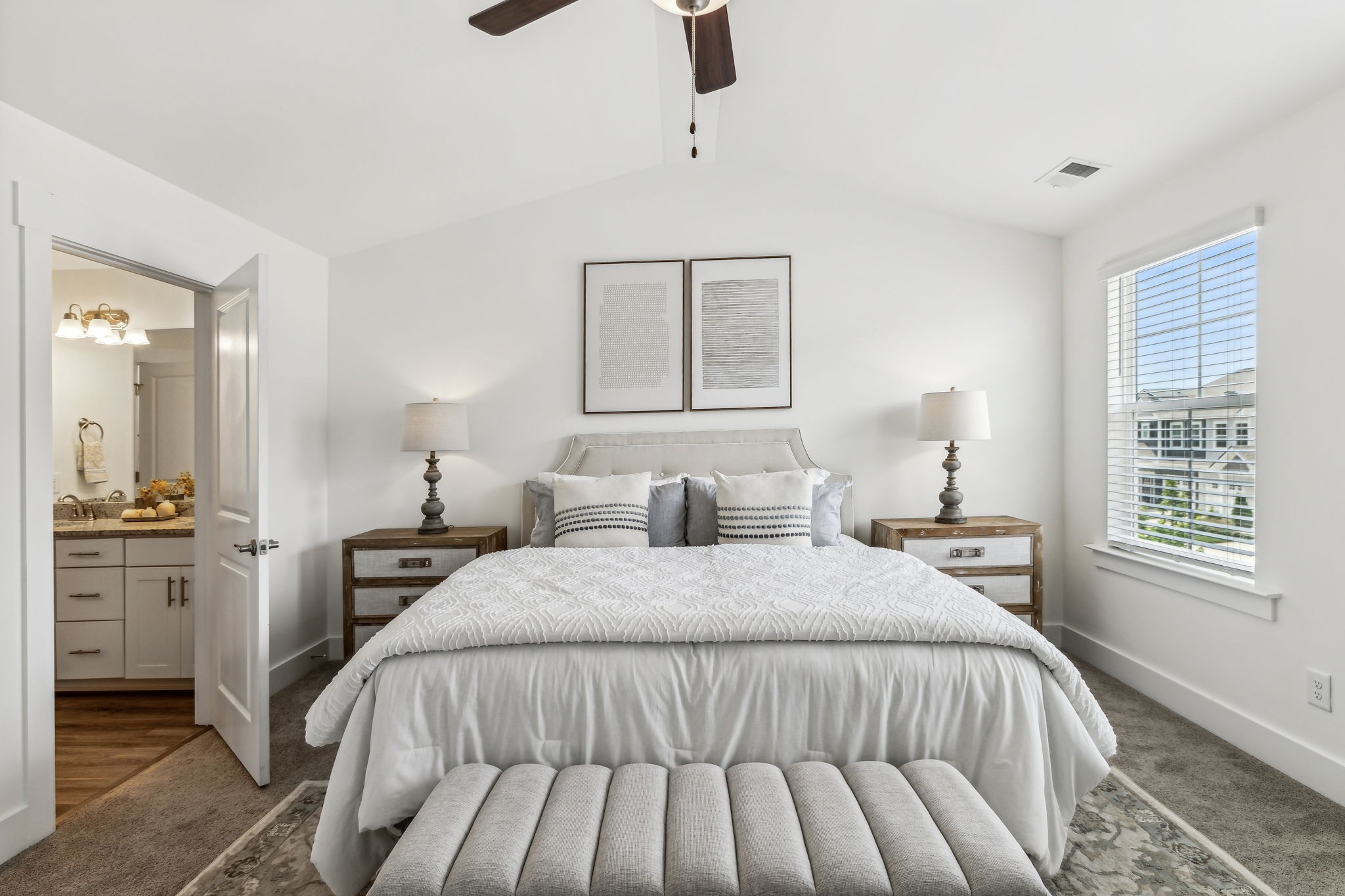 7144 Gracious Drive Franklin, TN 37064 - Photo 18 of 32 a bedroom with a large bed and a chandelier