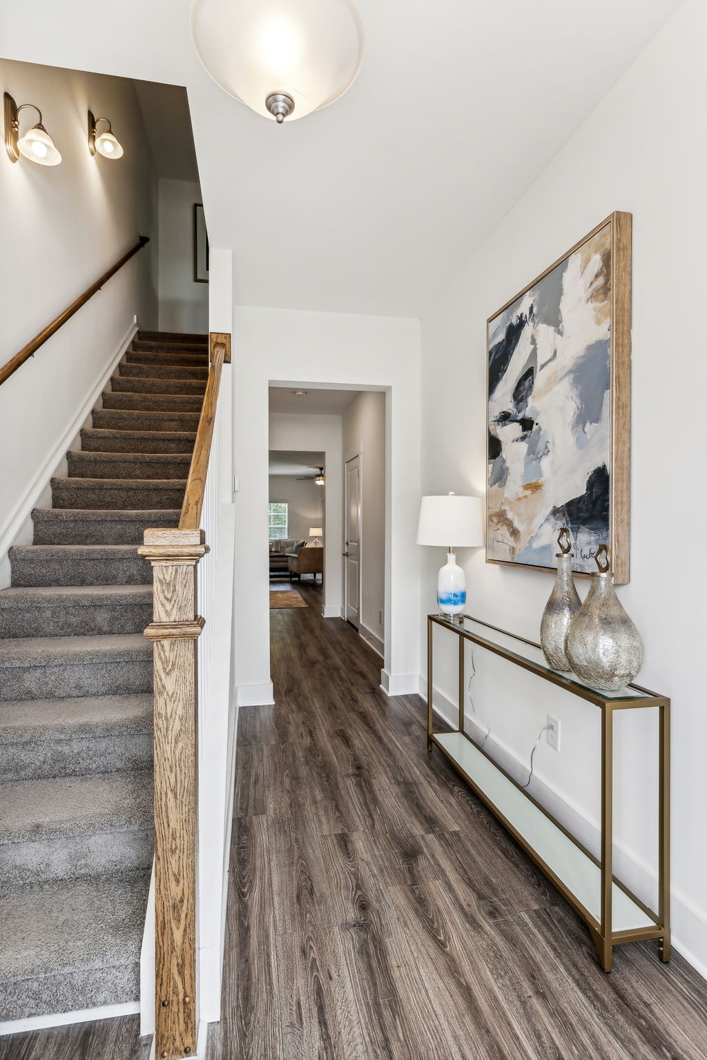 7144 Gracious Drive Franklin, TN 37064 - Photo 2 of 32 a view of a hallway with wooden floor and staircase