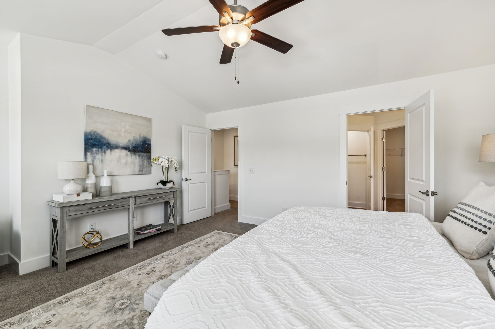 7144 Gracious Drive Franklin, TN 37064 - Photo 21 of 32 a bedroom with a bed and a chandelier