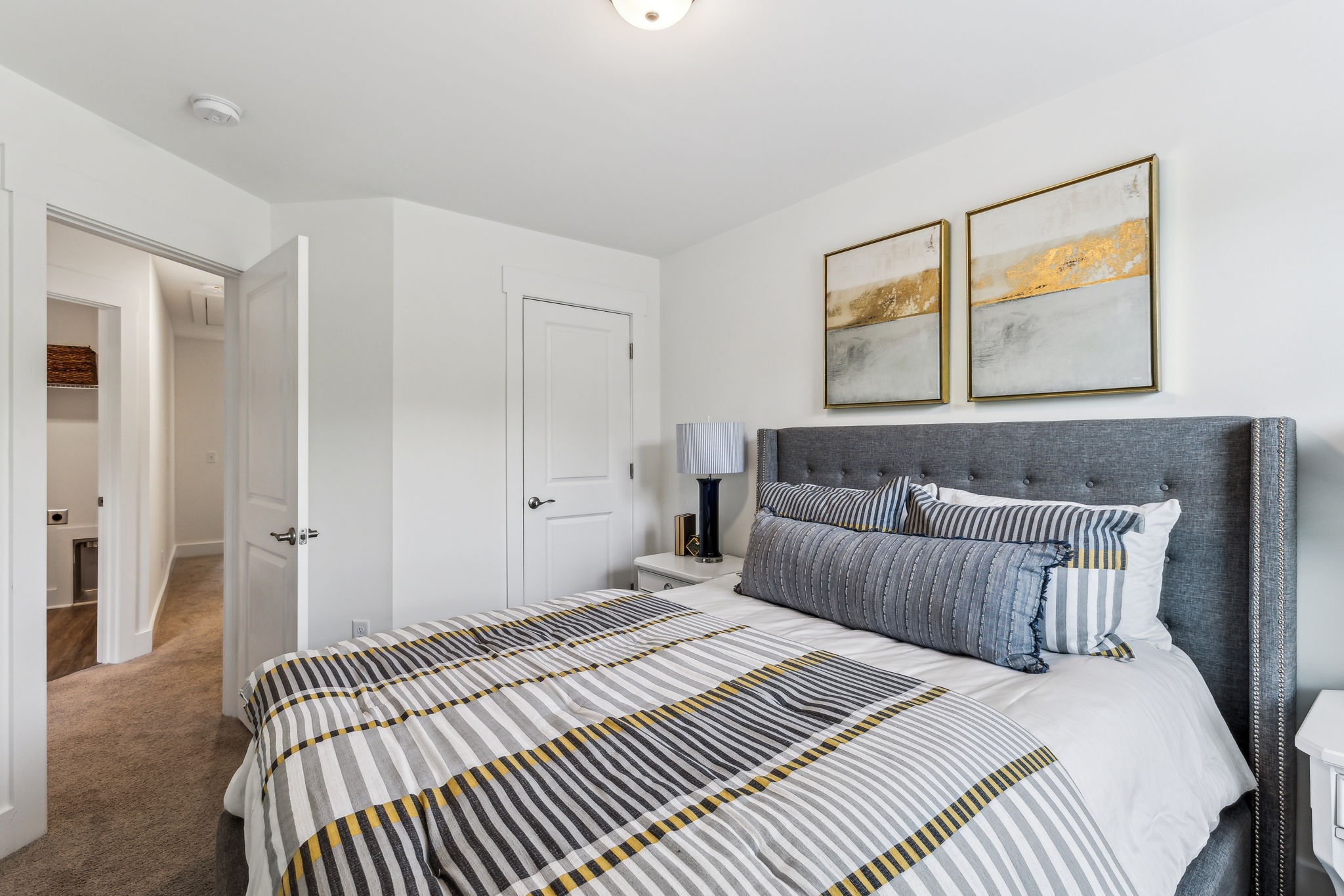 7144 Gracious Drive Franklin, TN 37064 - Photo 29 of 32 a bedroom with a bed and a painting on the wall