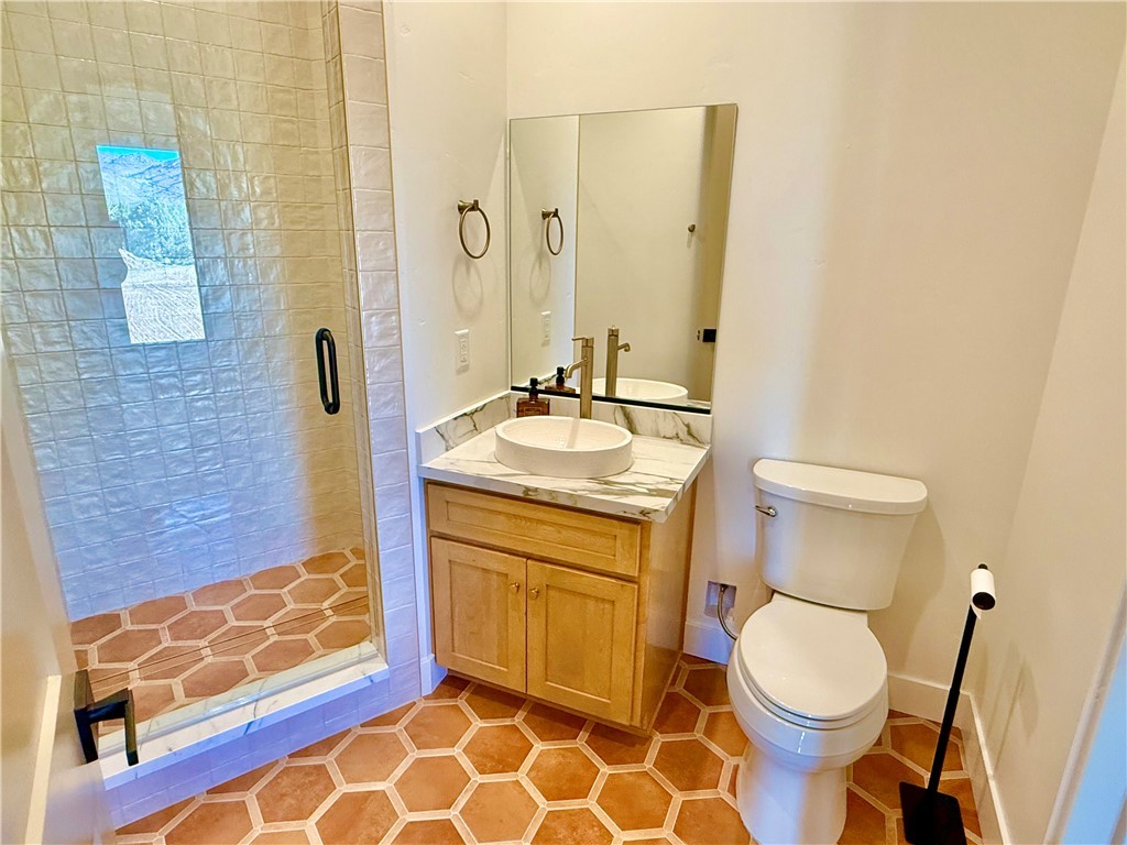 919 West Jordan Ranch Road Kingman, AZ 86409 - Photo 25 of 53 Guest bath with custom tile flooring and walk in shower with tile to the ceiling!