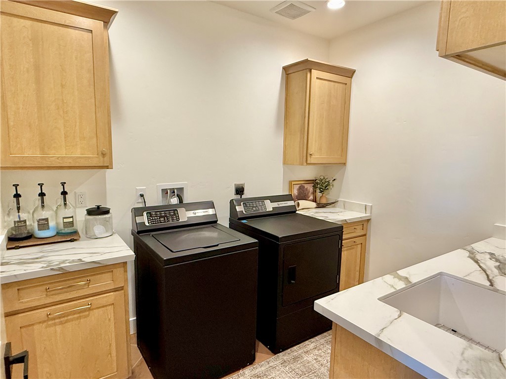919 West Jordan Ranch Road Kingman, AZ 86409 - Photo 28 of 53 Oversized laundry room has extra storage, counter space, and a sink!