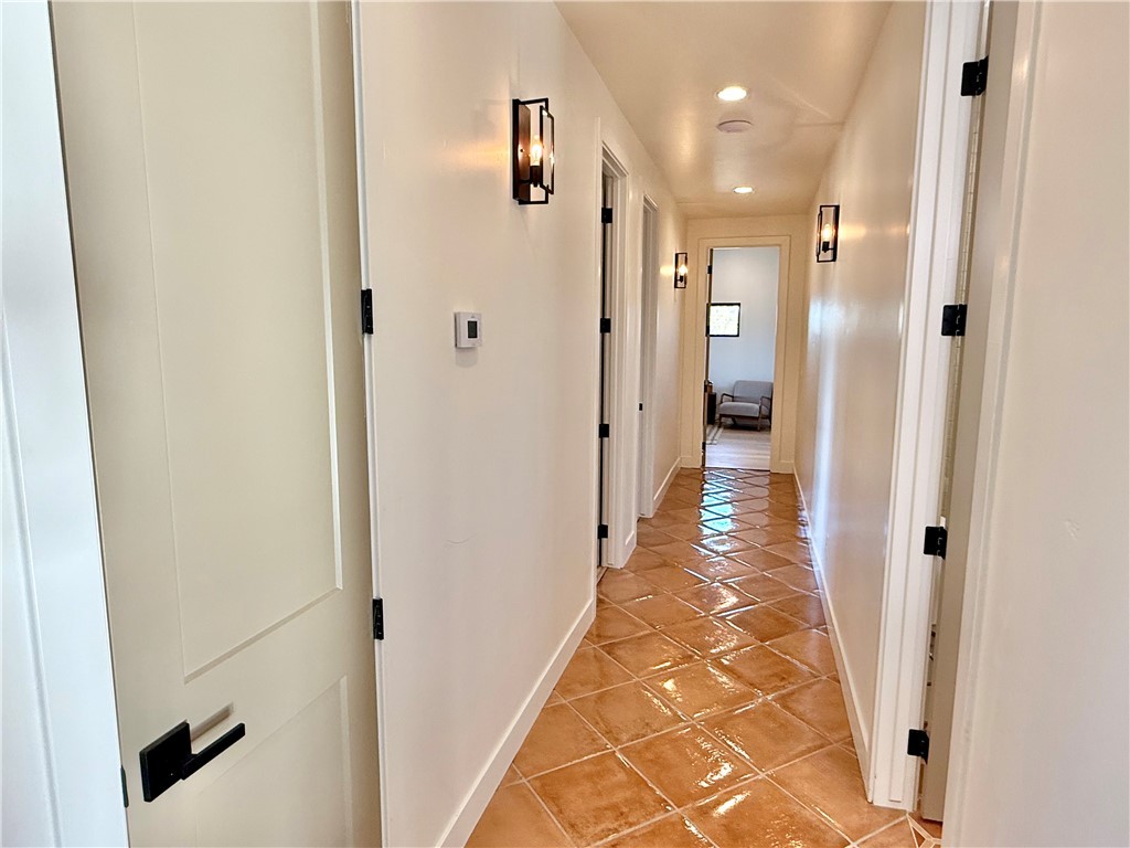 919 West Jordan Ranch Road Kingman, AZ 86409 - Photo 30 of 53 Hallway to the bedrooms and guest bath #2. Custom wall pendants light the way!