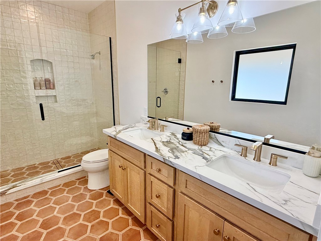 919 West Jordan Ranch Road Kingman, AZ 86409 - Photo 40 of 53 Dual sinks and birch cabinetry with an amazing walk in shower.