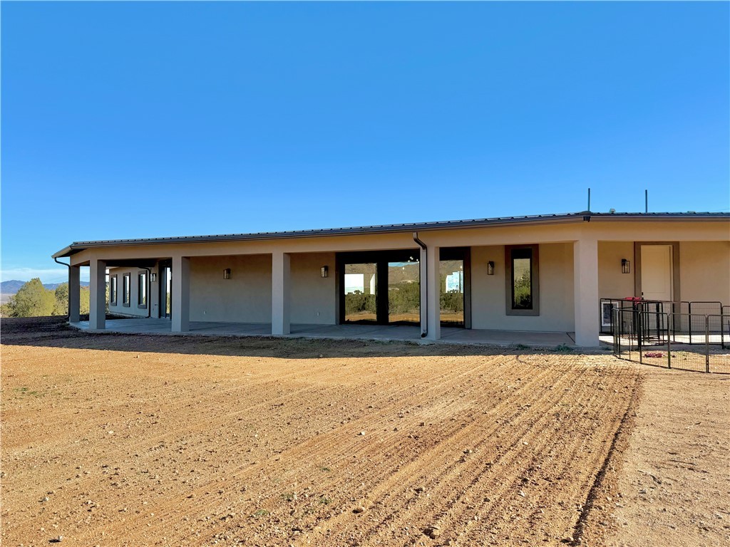 919 West Jordan Ranch Road Kingman, AZ 86409 - Photo 7 of 53 Oversized covered patio opens up to the amazing property and offers stunning views of the Cerbat Mtns.