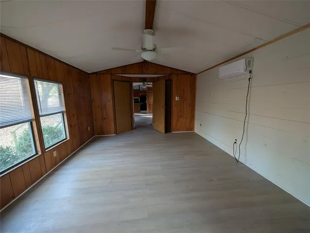 a view of empty room with large windows