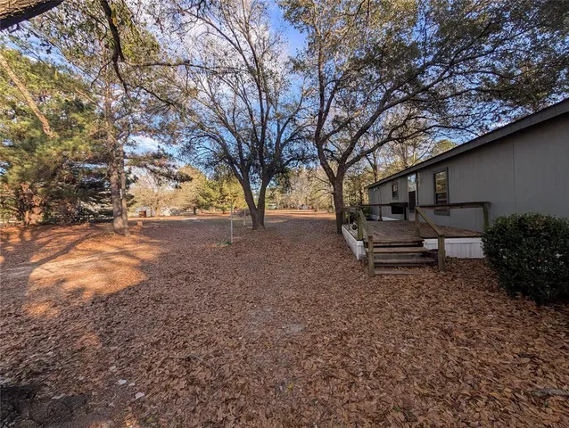 a view of backyard with trees