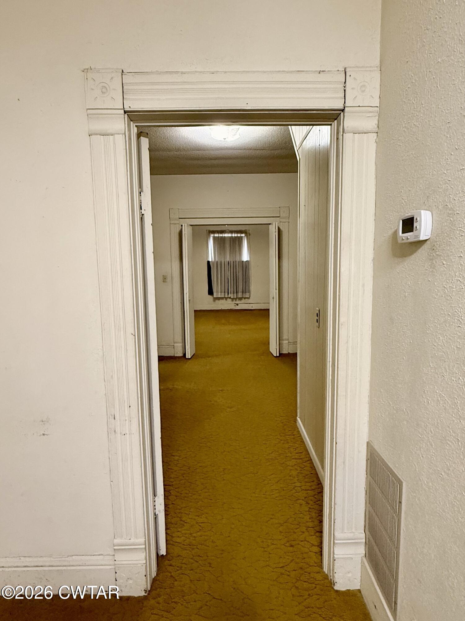 406 Maple Heights Street Kenton, TN 38233 - Photo 18 of 43 a view of a hallway with wooden floor and closet