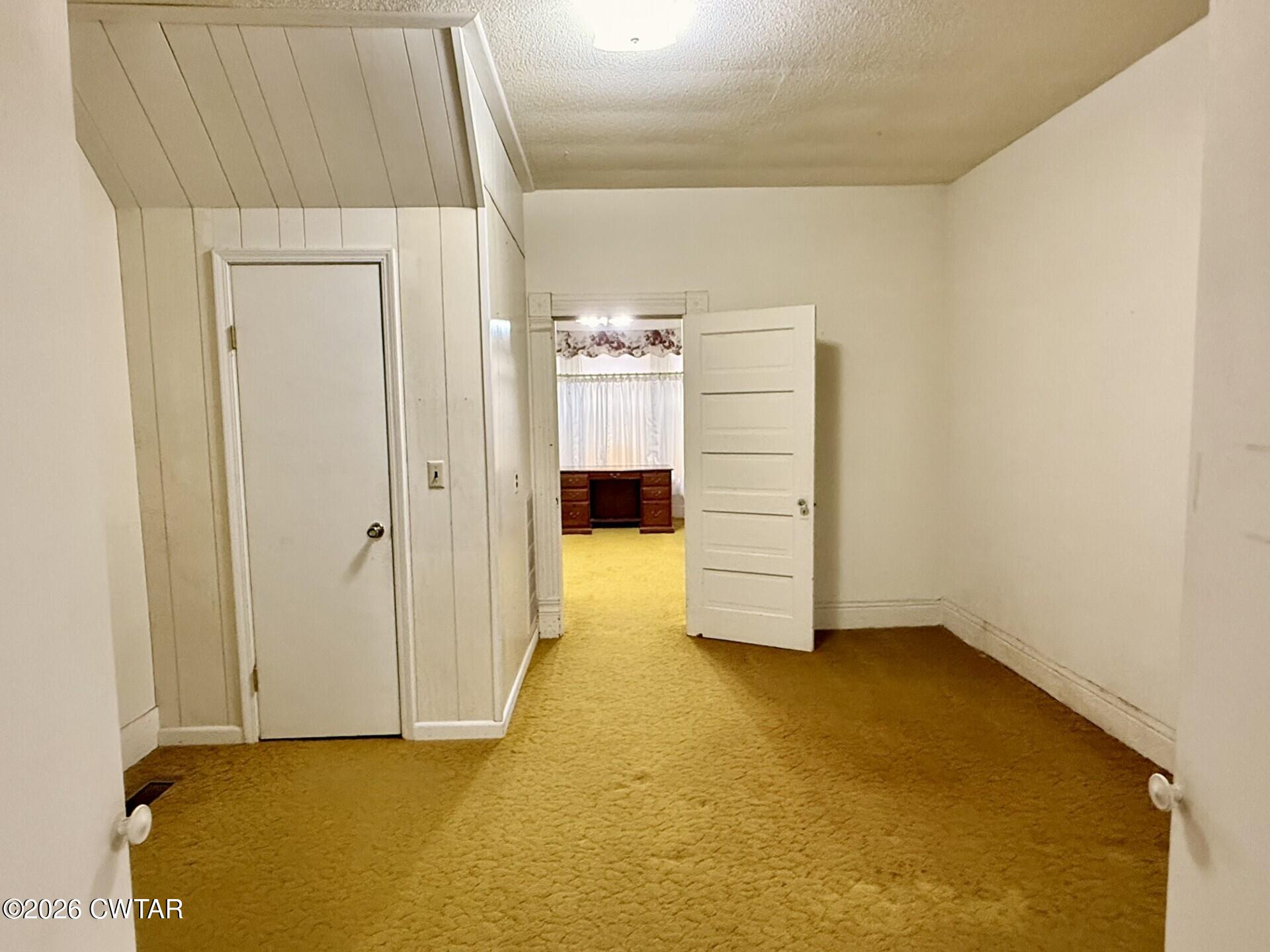 406 Maple Heights Street Kenton, TN 38233 - Photo 20 of 43 a view of an empty room with a fireplace