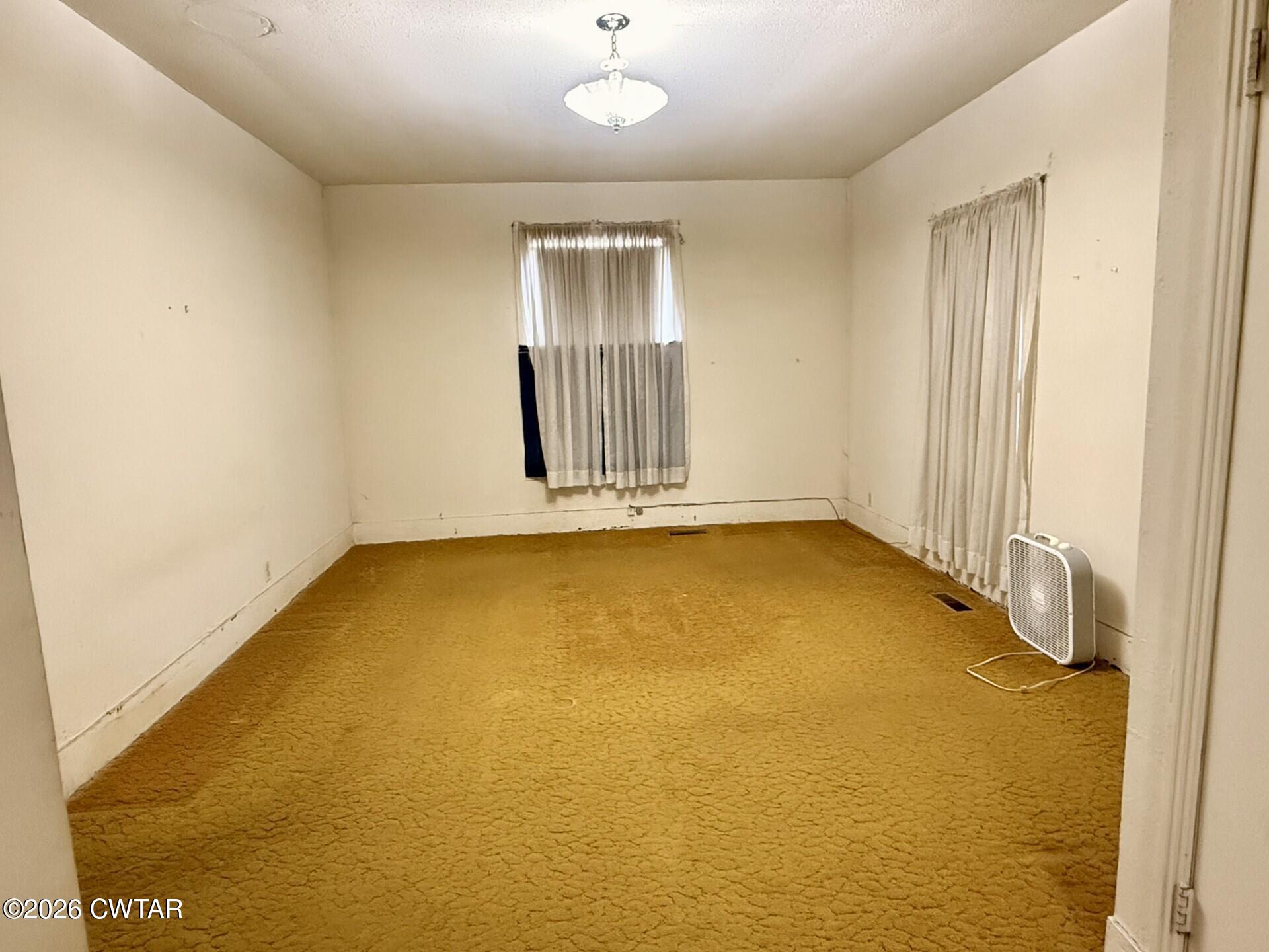 406 Maple Heights Street Kenton, TN 38233 - Photo 21 of 43 an empty room with a window